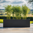 Flatpacked zinc galvanised trough planter, matte black, 150 lifestyle bamboo front