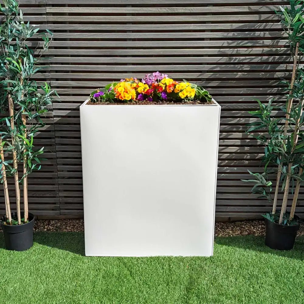 Versatile tall planter in white with a liner, allowing you to customize your potting needs.