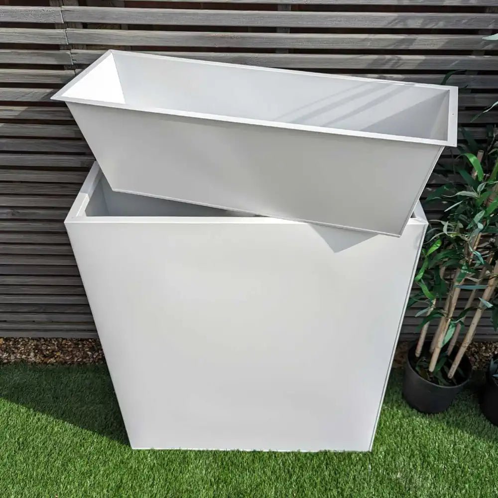 Large white planter with insert, providing ample room for showcasing your favorite greenery.