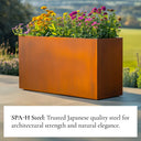 Corten steel planter box with flowers against a natural background