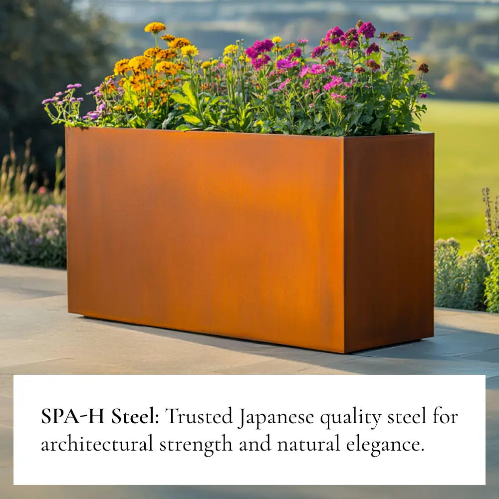 Rusty metal planter box with flowers against a natural background