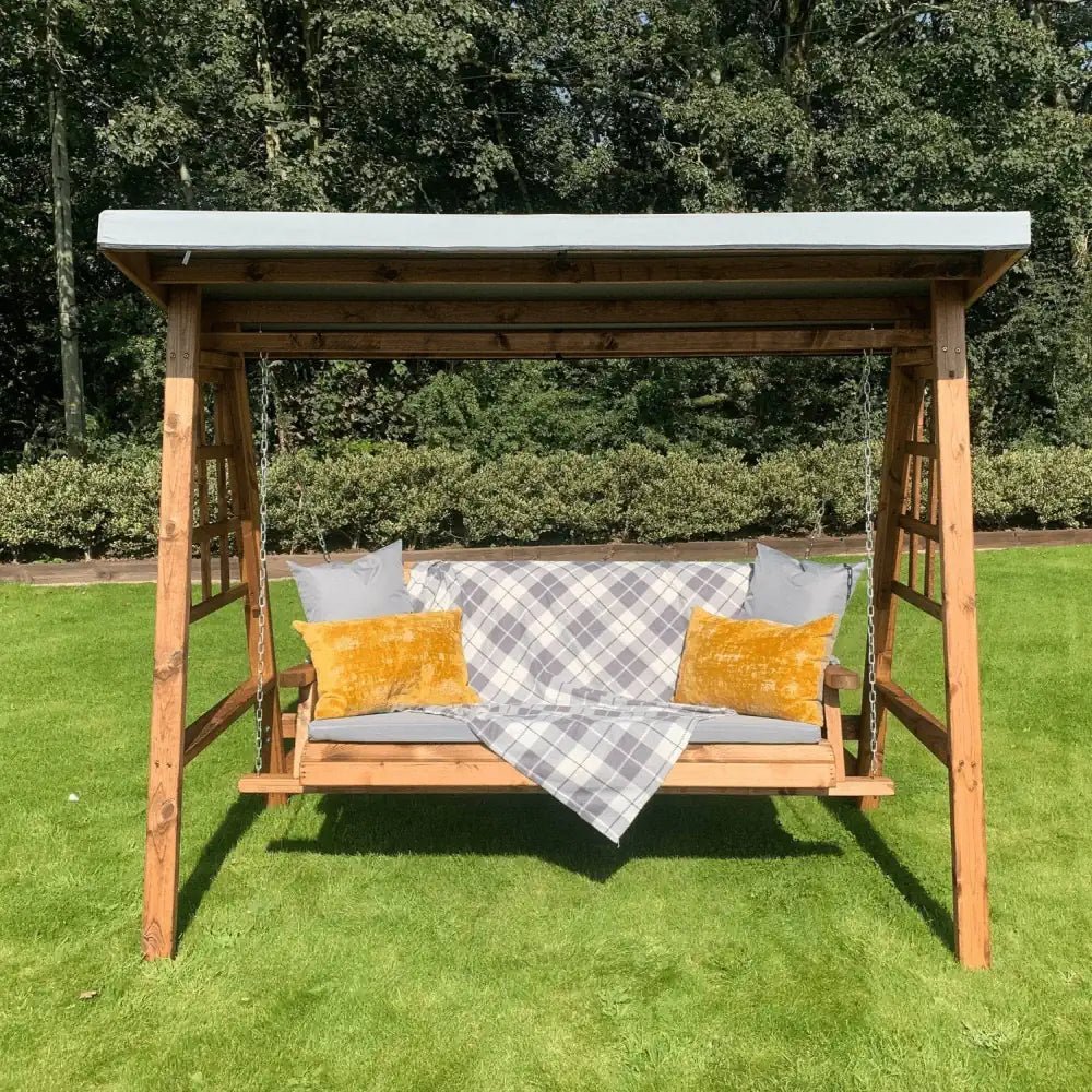 Elevate your lawn with this stylish Wooden Lawn Furniture set, including a Grey Wood Swing Seat and matching table.
