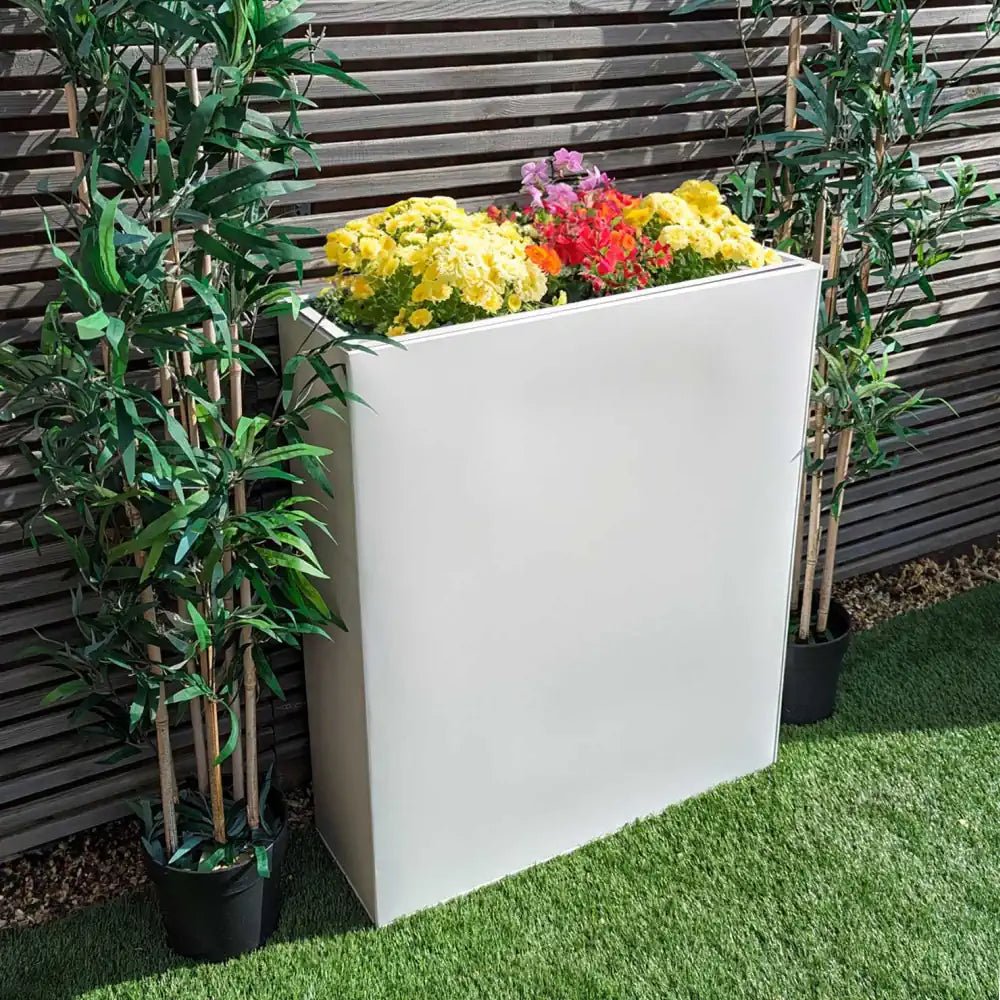 Bright white trough planter with removable insert, bringing a clean, contemporary look to your space.