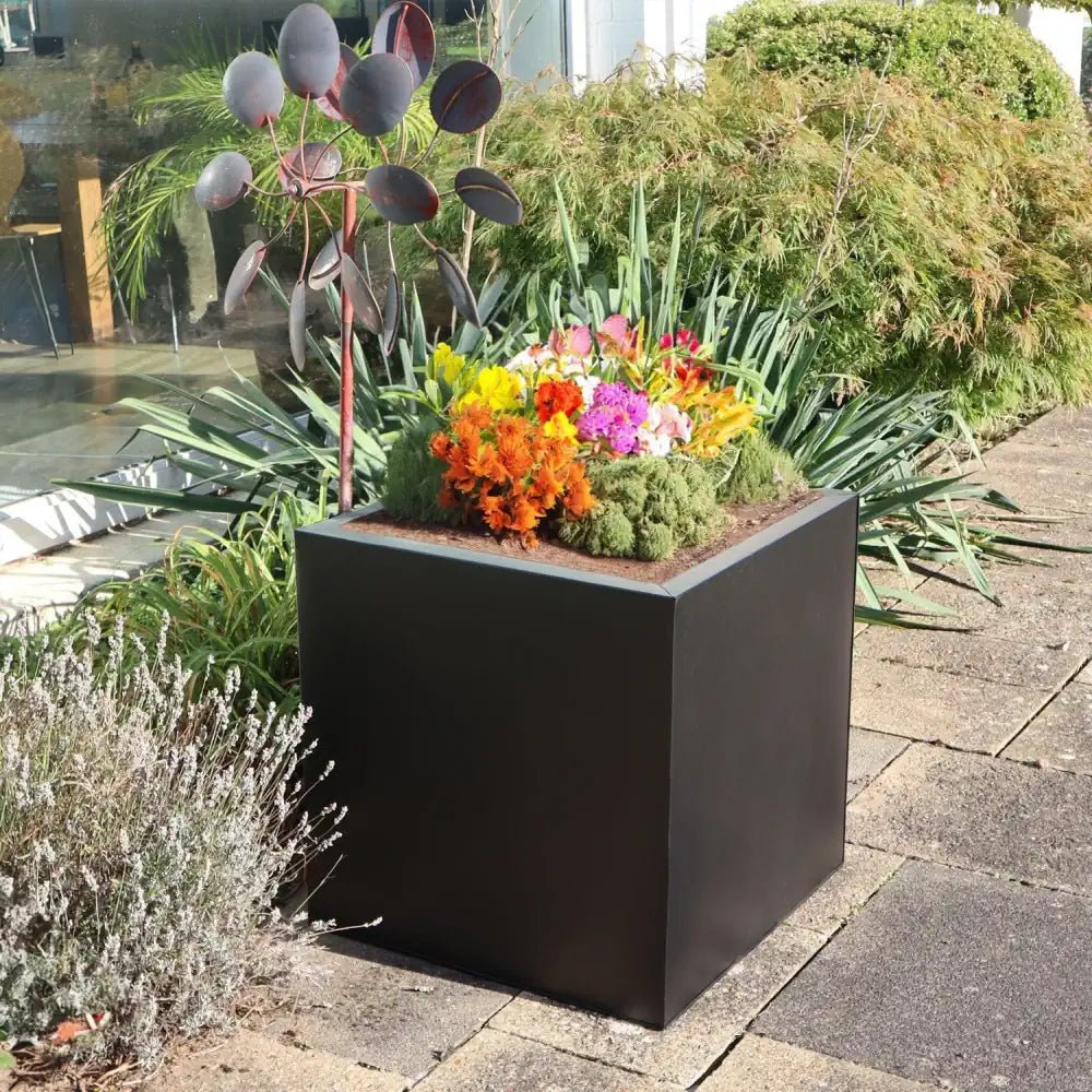 Overflowing with blooms, these large outdoor planters evoke tranquility.
