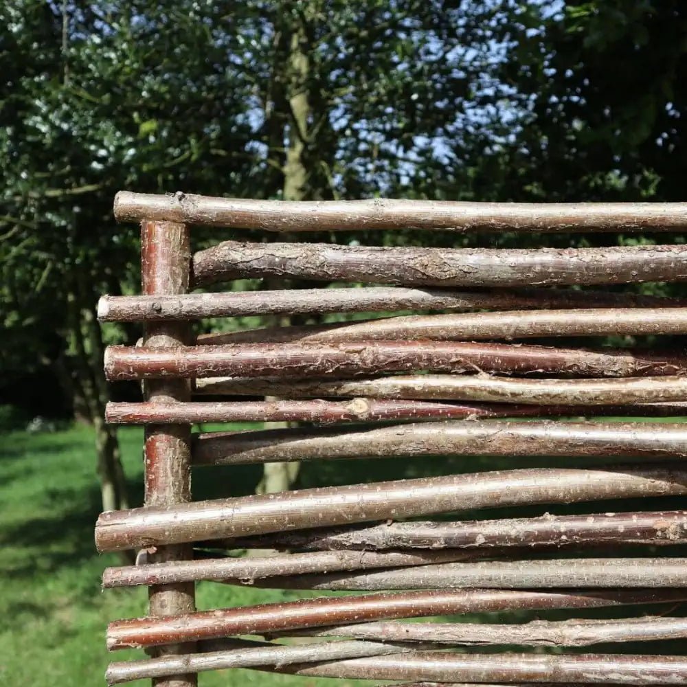 Natural hazel hurdles by Tulipy, adding a touch of artisanal elegance to any garden.