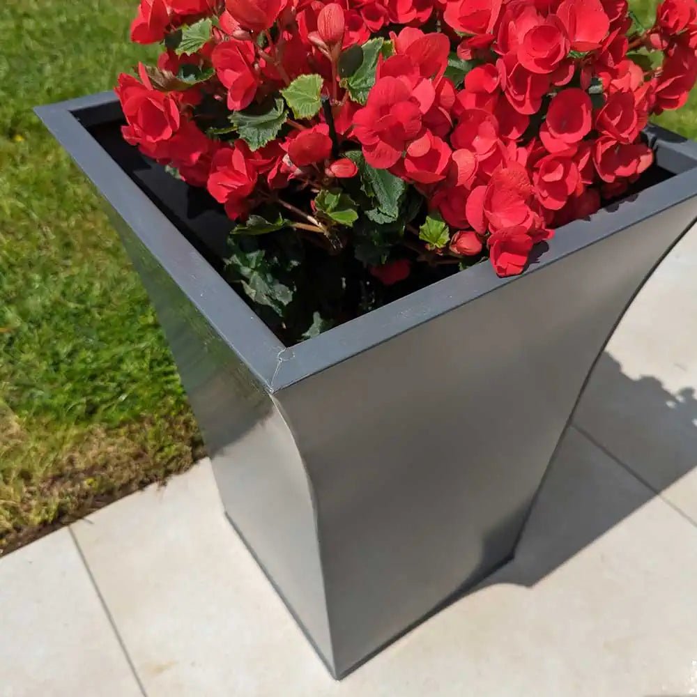 Decorative garden pots filled with blooming flowers