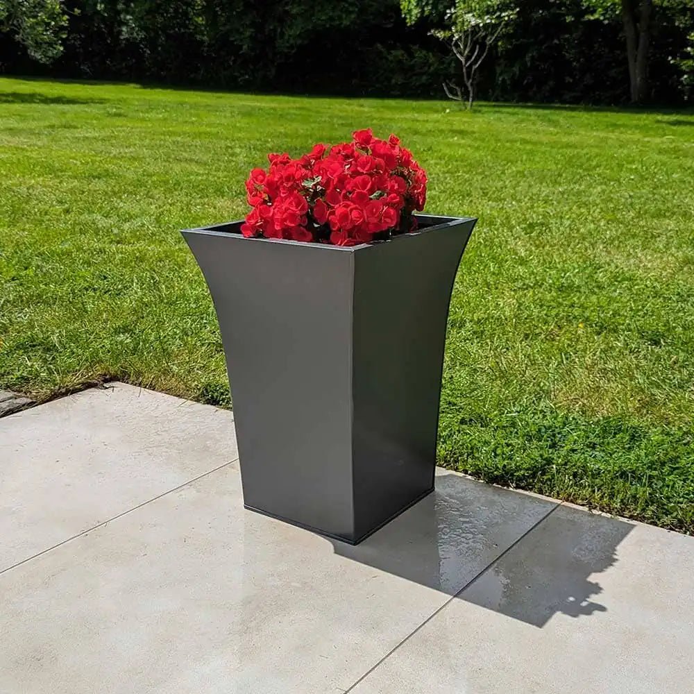 Round planters placed around a water feature
