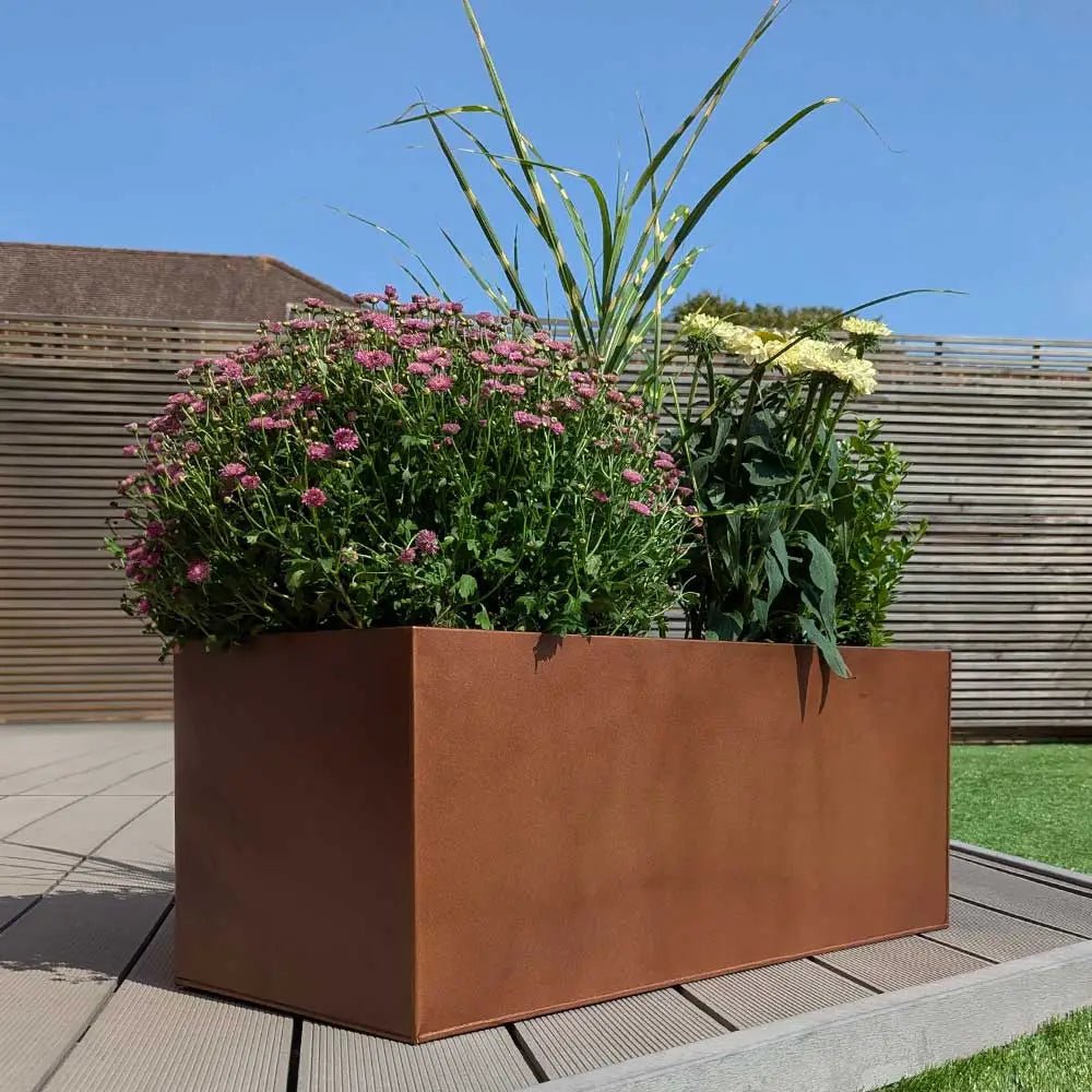 copper brown zinc trough planter with plants