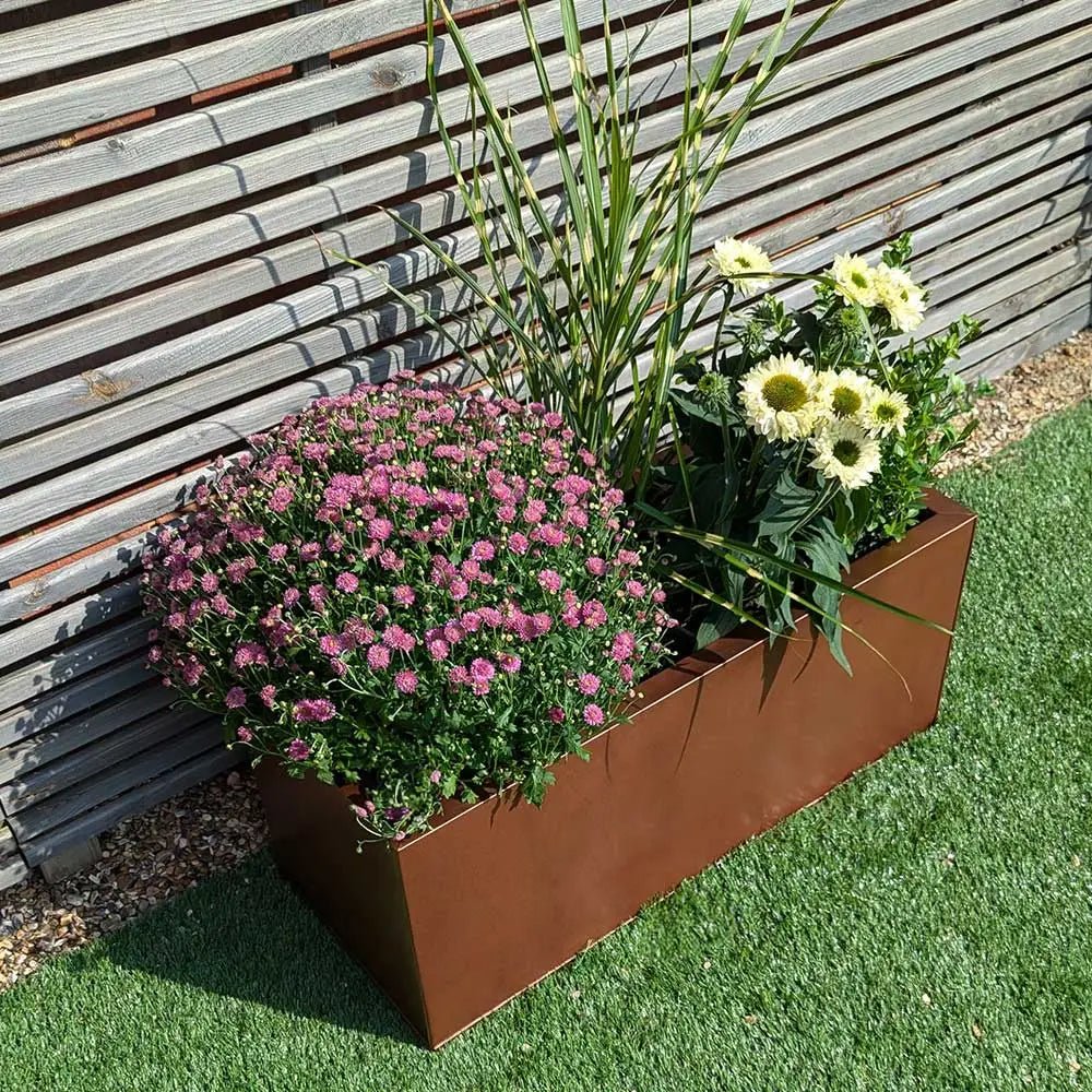 copper brown zinc trough planter with plants