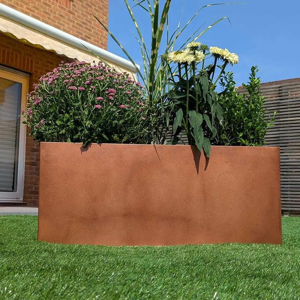 copper brown zinc trough planter with plants