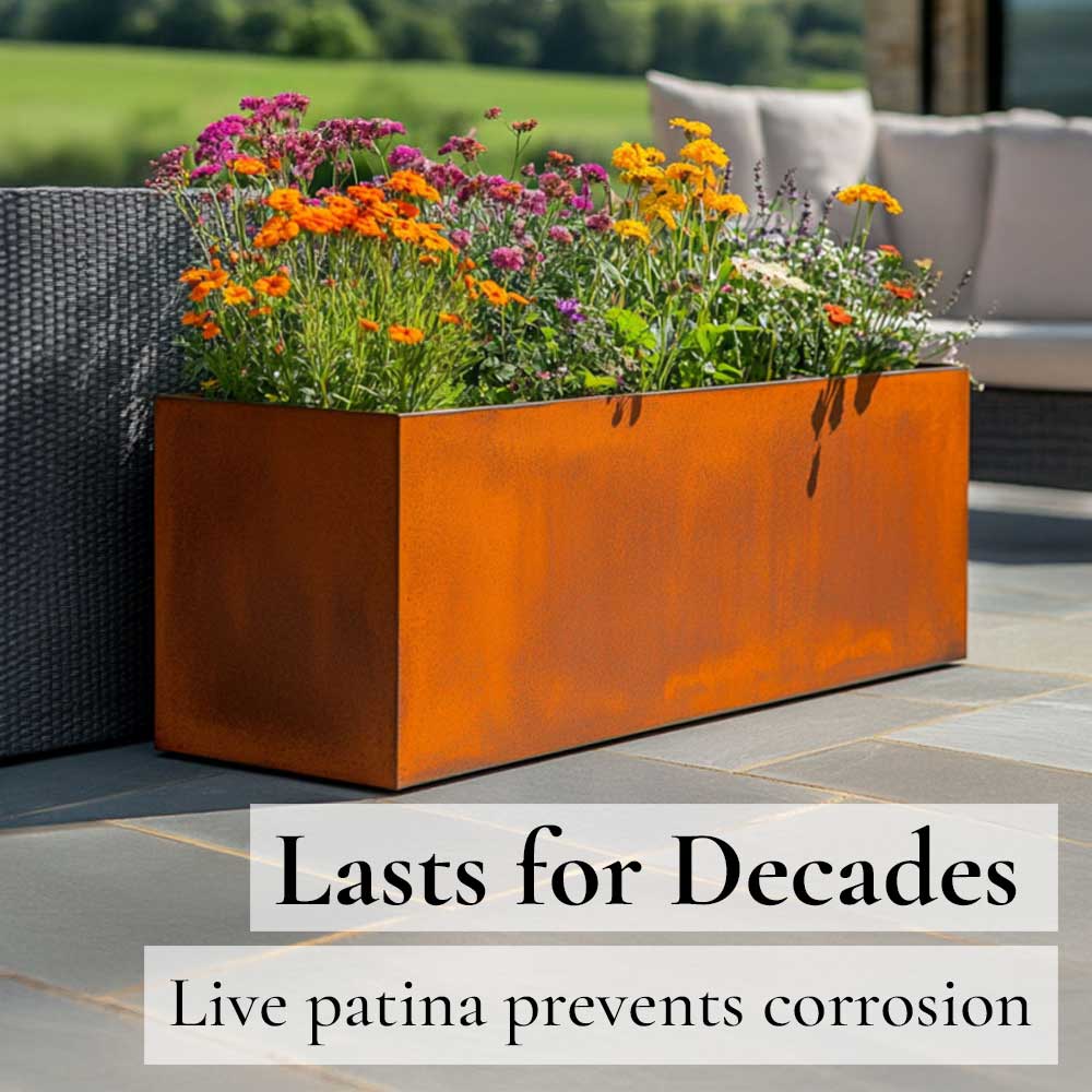 Rusty metal planter with flowers on a patio