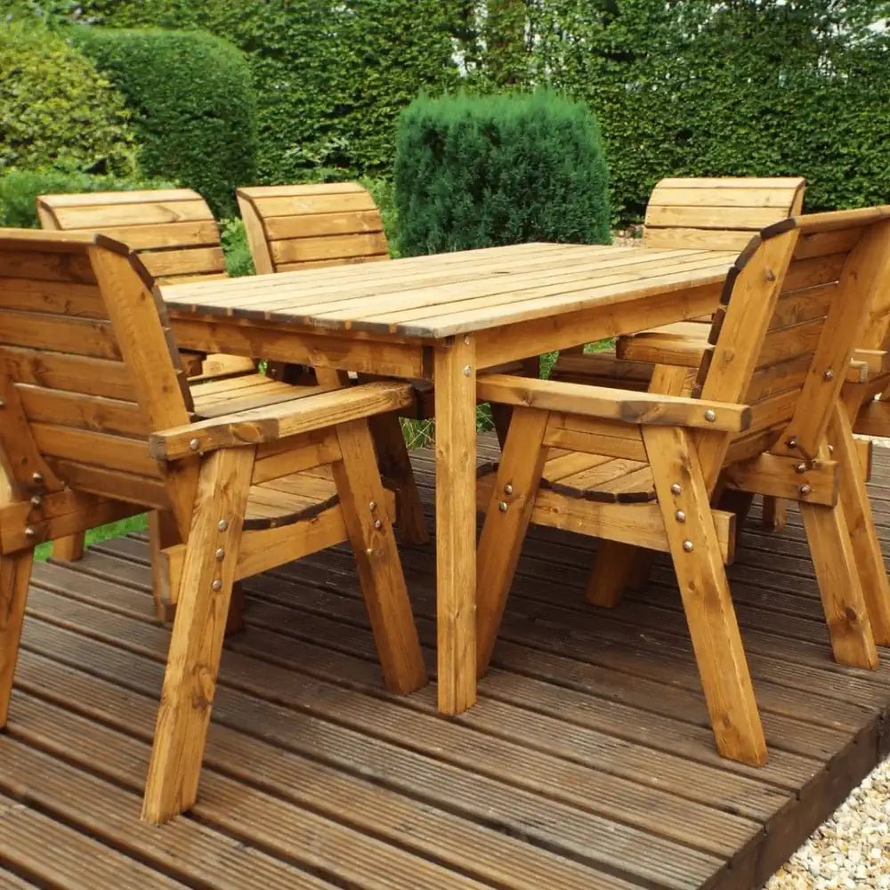 A luxurious six-seater teak garden furniture dining set with comfortable chairs and a spacious table