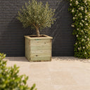 Deluxe Square Planter planted in a garden setting