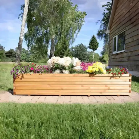 extra large pine wood planter planted with bedding