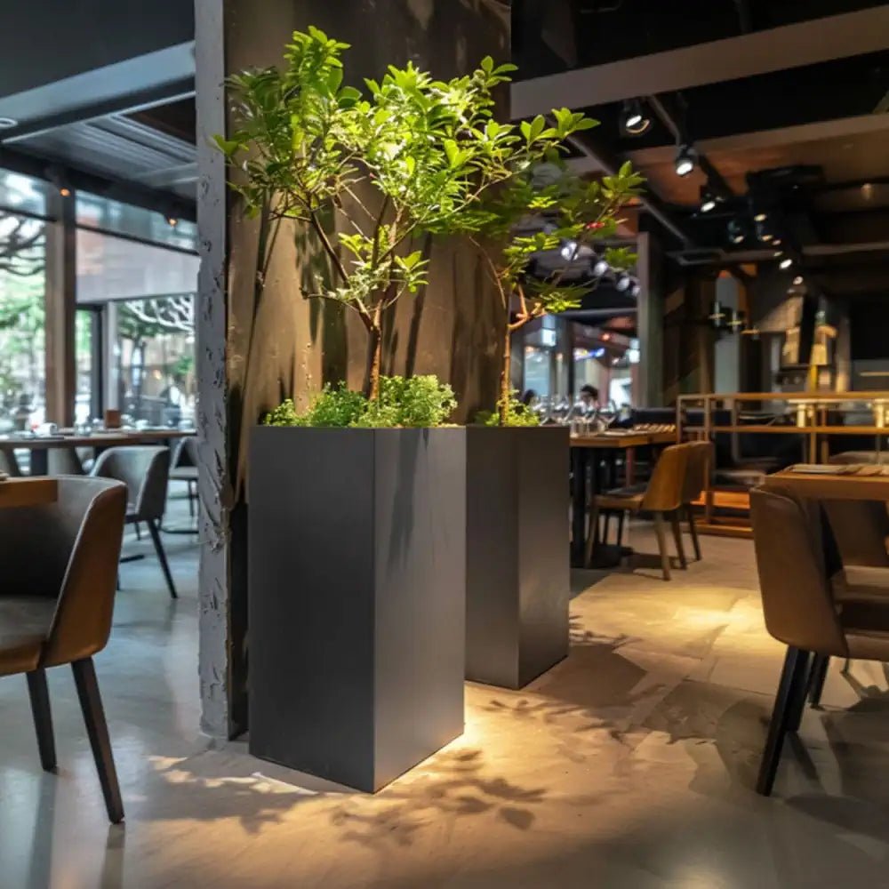 Large grey plant pots standing tall, ready to showcase vibrant blooms.