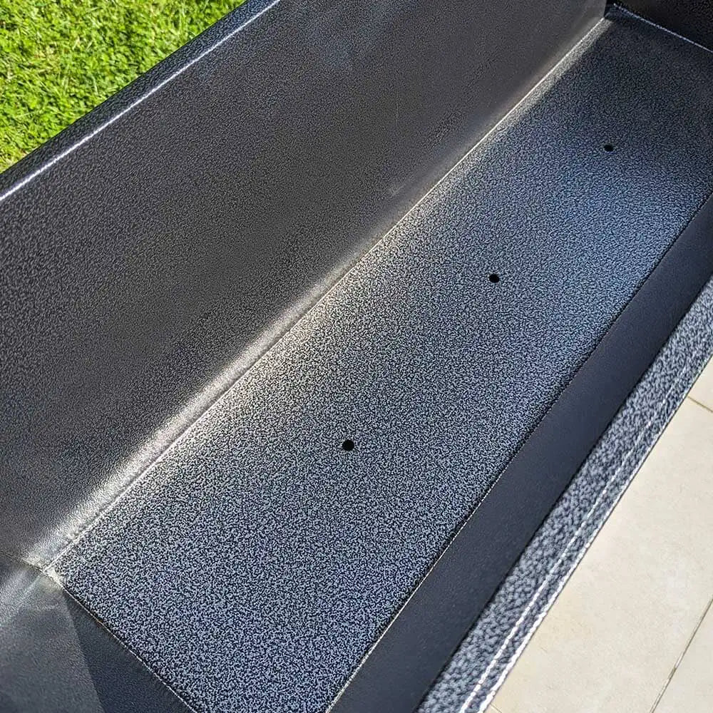 A collection of long planters in a modern garden