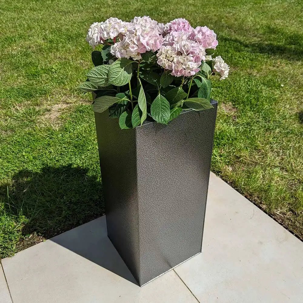 Assorted zinc planters adding flair to a rooftop garden