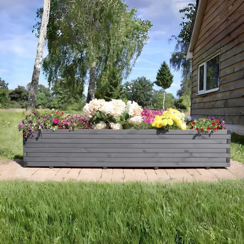 Huge wooden trough planters allow you to cultivate even the largest plants and create a flourishing garden.