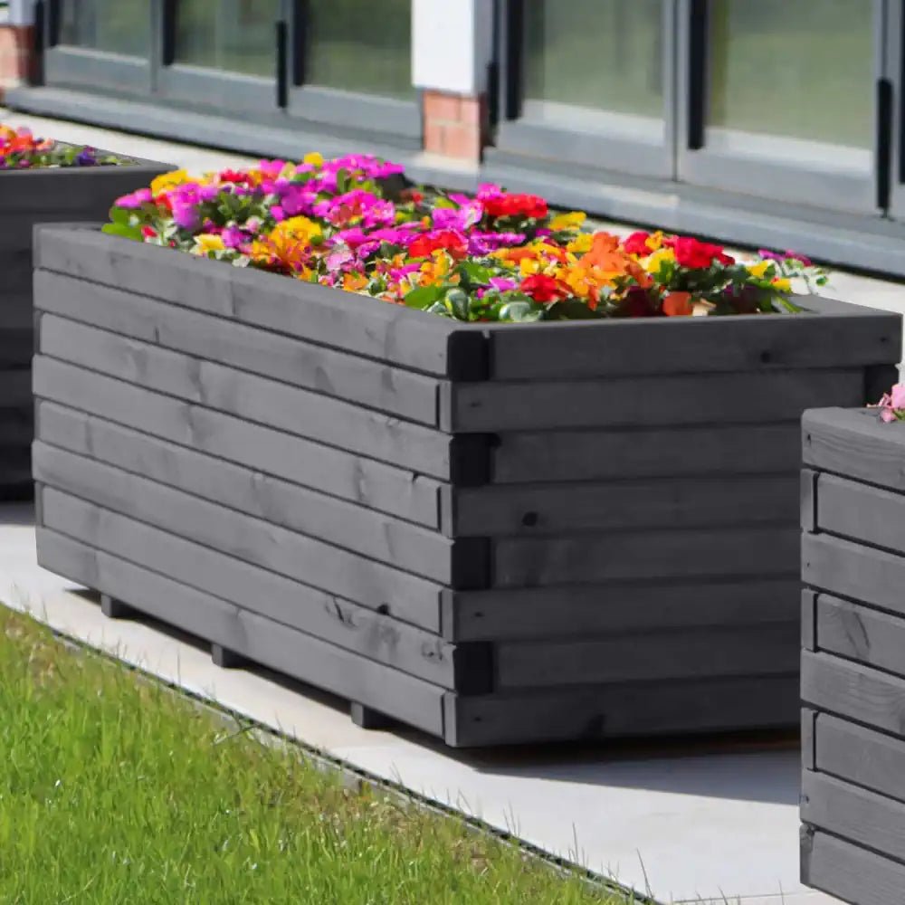 Painted wooden planters in various colors add a touch of personality to your garden décor.