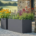 Flatpacked zinc galvanised trough planter, matte grey, lifestyle gravel