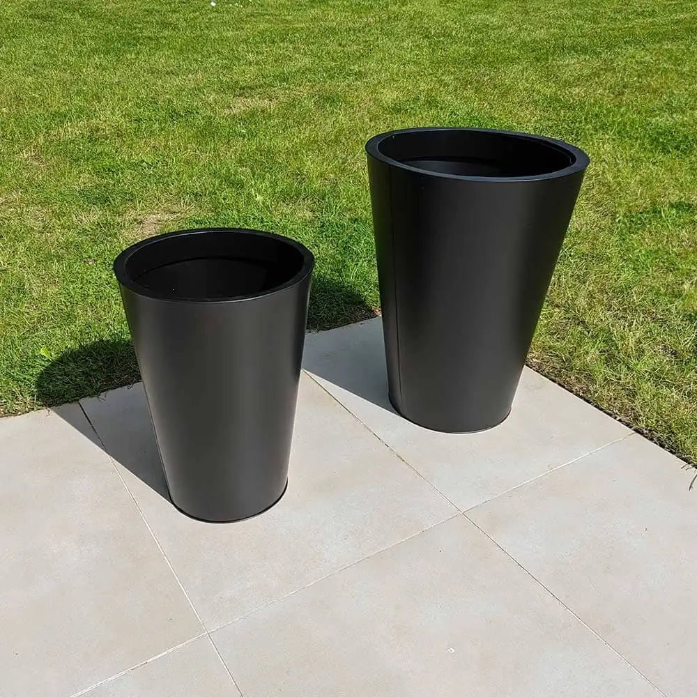 Elegant tall planters enhancing a modern outdoor space.
