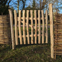 Picket gate adding a touch of nostalgia to your landscape.