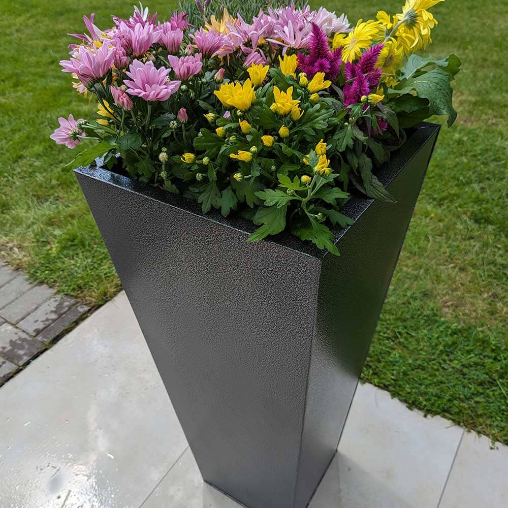 Large garden planters lining a patio area