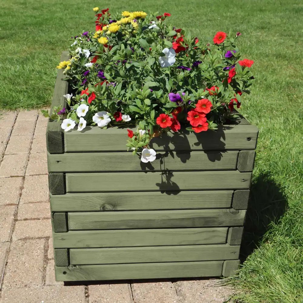 Extra-large wooden planter bursting with vibrant flowers, adding a statement piece to your patio.