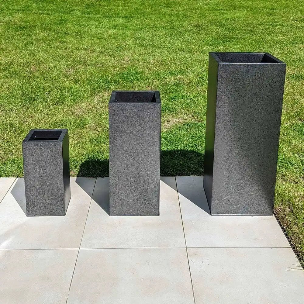 Large garden planters nestled among lush greenery