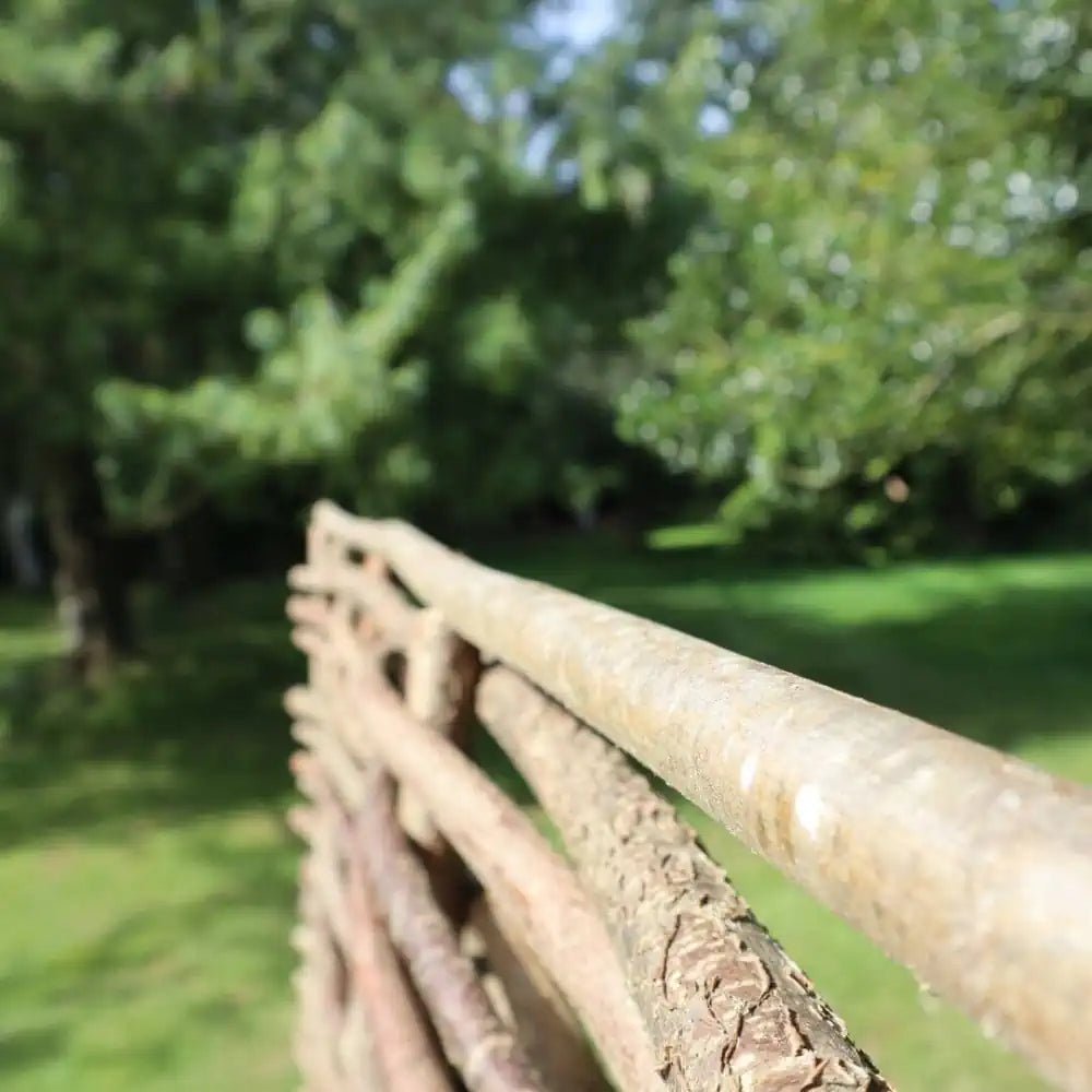 Durable hazel hurdle panels offering a sustainable and environmentally friendly fencing option.