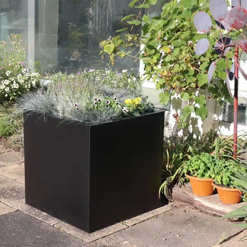 Add sophistication to your space with a black planter pot large.