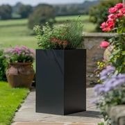 Metallic zinc planters blending seamlessly into any landscape.