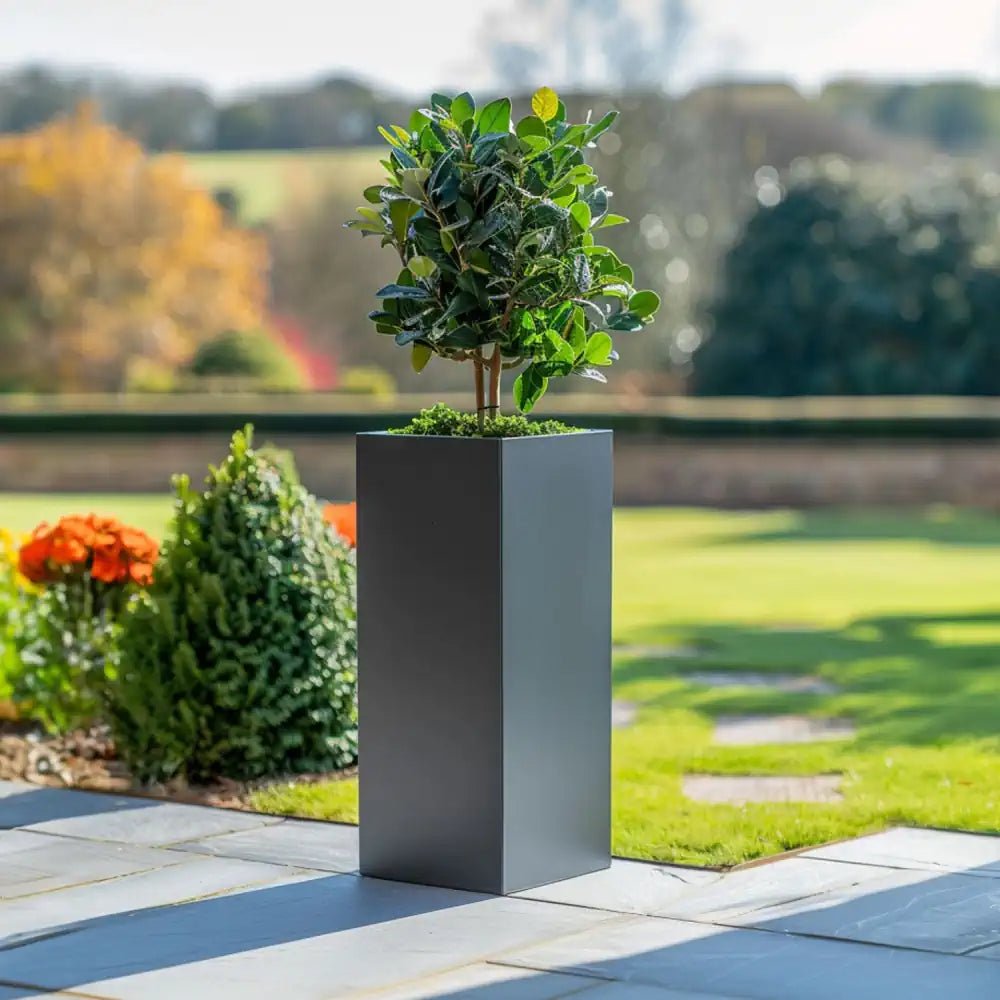 A sleek standing grey planter, ideal for contemporary outdoor decor.