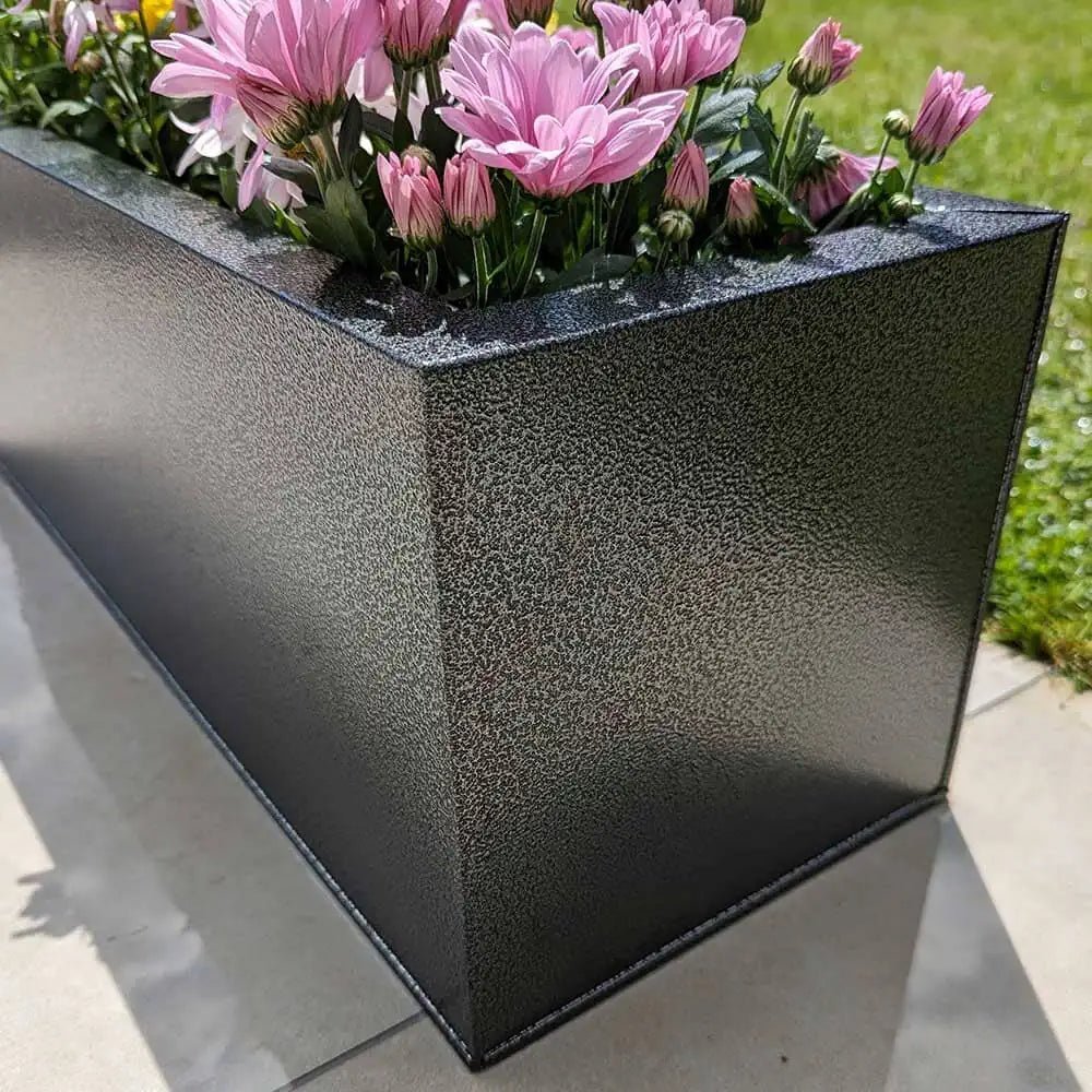Monumental presence of huge planters in the garden.