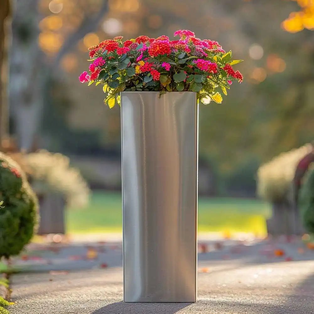 A row of sleek tall outdoor planters lining a patio.