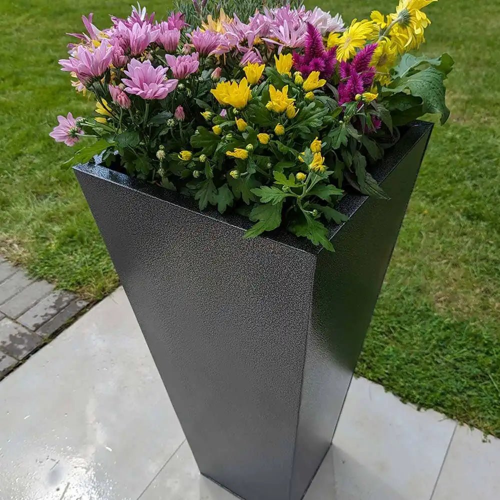 Zinc planters adding a touch of elegance to the porch.