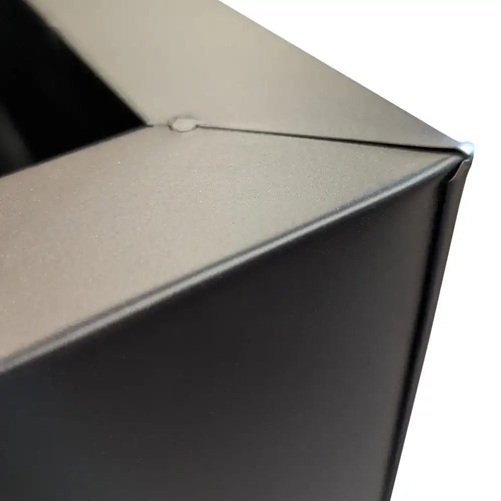 Array of zinc planters creating a contemporary garden display.