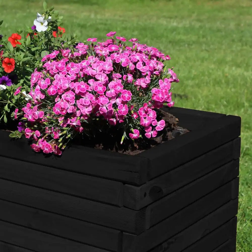 Large plant container: This extra-large green planter is a stylish and functional container for your favorite outdoor plants.