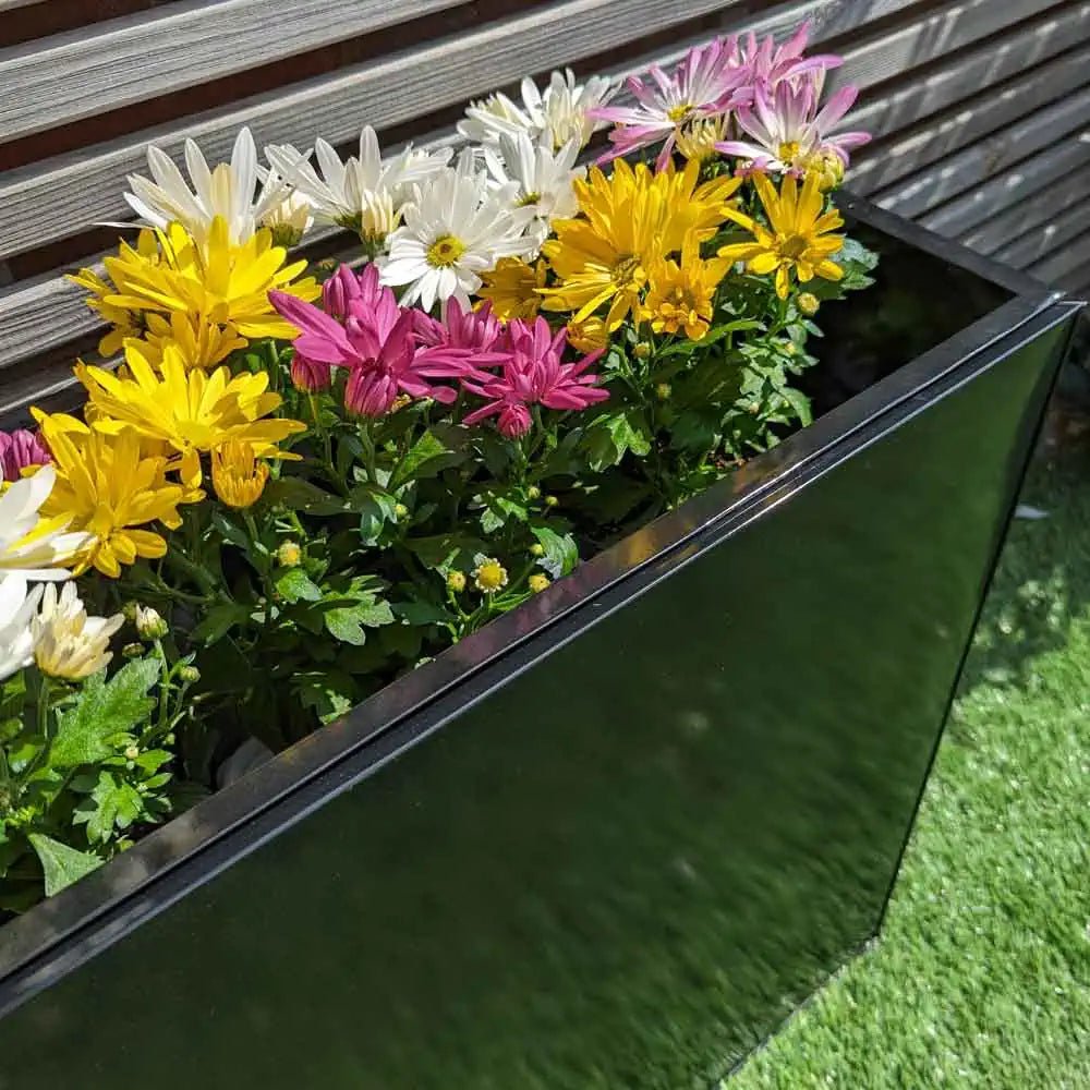 Overflowing with greenery, these large garden pots bring life to any yard.