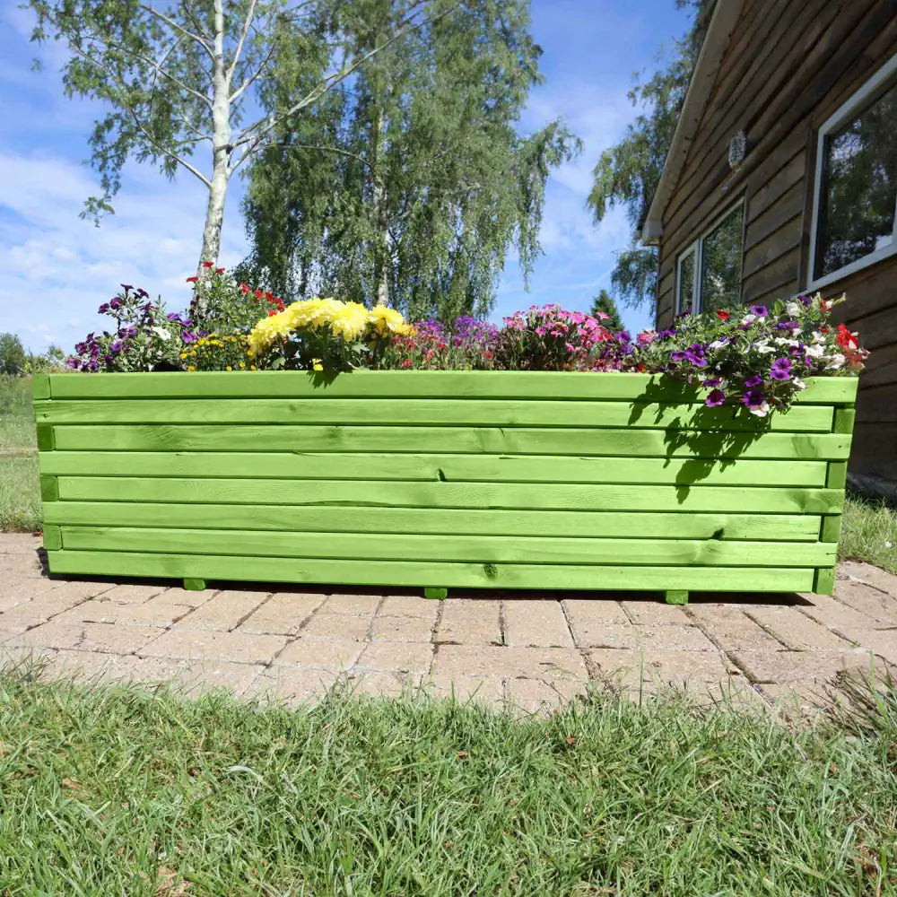 Custom weathered zinc planters zoning the dining and lounge areas of the terrace.
