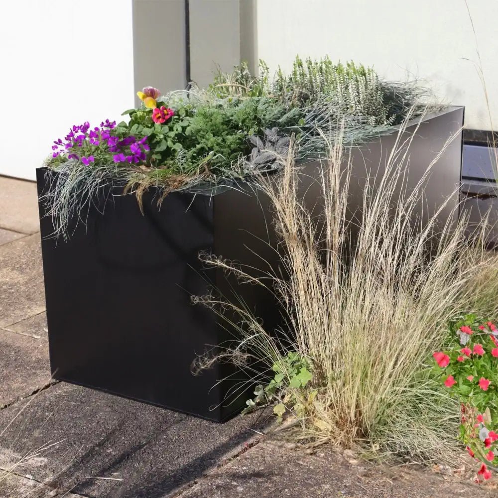 Elevate your home's entrance with this stunning zinc planter, creating a welcoming first impression.