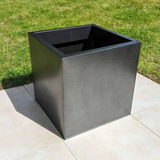 Zinc planters blending seamlessly with the outdoor decor.