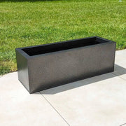 Linear sophistication with long planters along pathways.