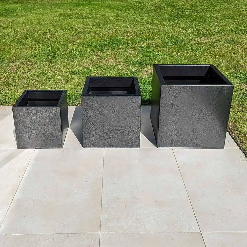 Vibrant flowers spilling over the edges of large trough planters
