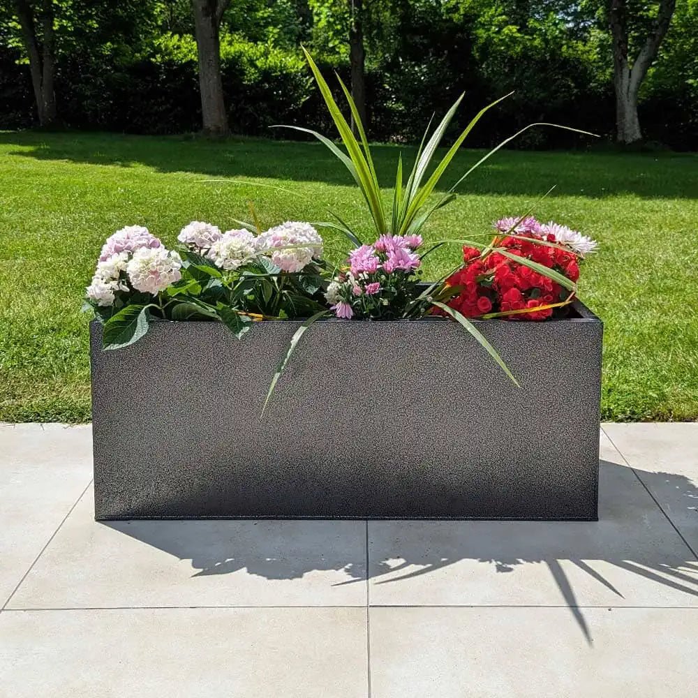 Rows of long planters filled with vibrant flora.