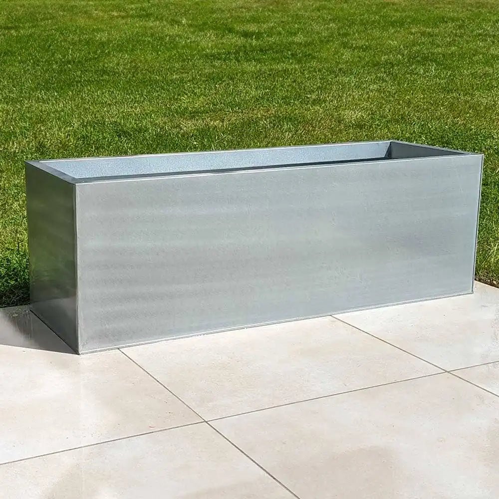 Trough planters arranged in symmetrical patterns.