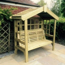 Wooden arbour enhancing the ambiance of a tranquil garden oasis.