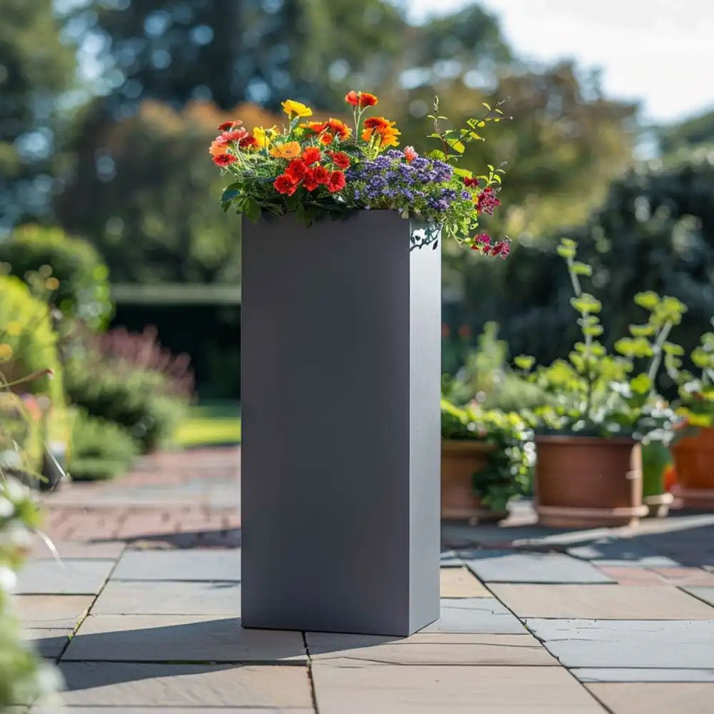 Standing grey pots arranged elegantly, adding sophistication to a patio.