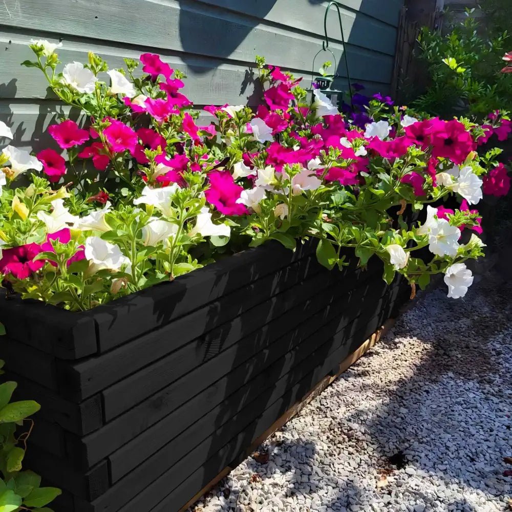 Extra-large wooden planter overflowing with vibrant flowers, adding a touch of nature to any patio.