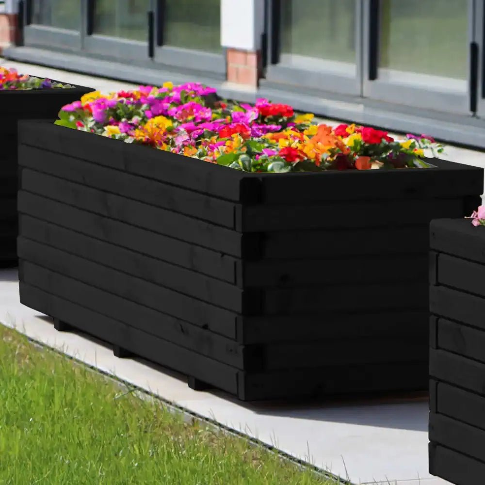 Painted wooden planter: Add a pop of color to your garden with this vibrant and customizable planter.